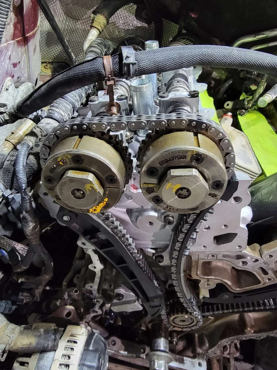Timing chain and engine components exposed during engine repair at Roy’s Mobile Mechanic HQ